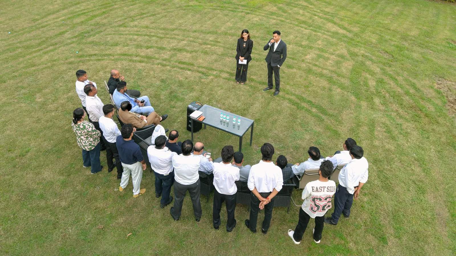 Aerial view of a LEATHER LUXURY team meeting on the factory lawn